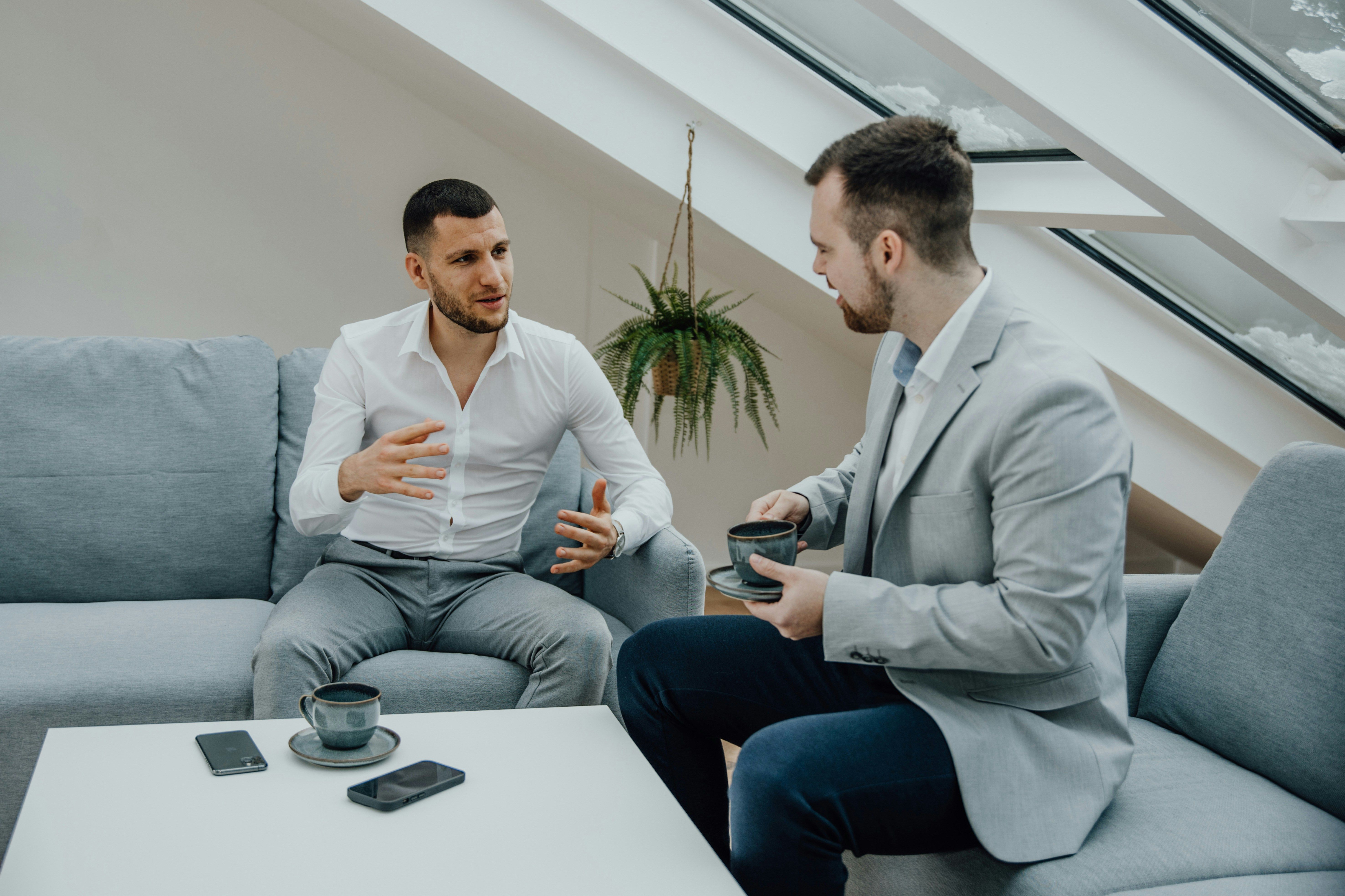 Business Meeting in Modern Lounge for Leveraging Finance Simulations for Talent Development
