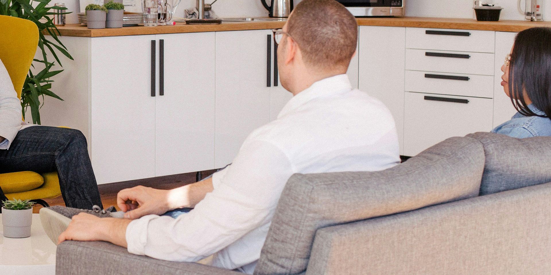 Couple Watching TV in Modern Living Room for How to Get Started in Venture Capital: Building Your Network and Expertise