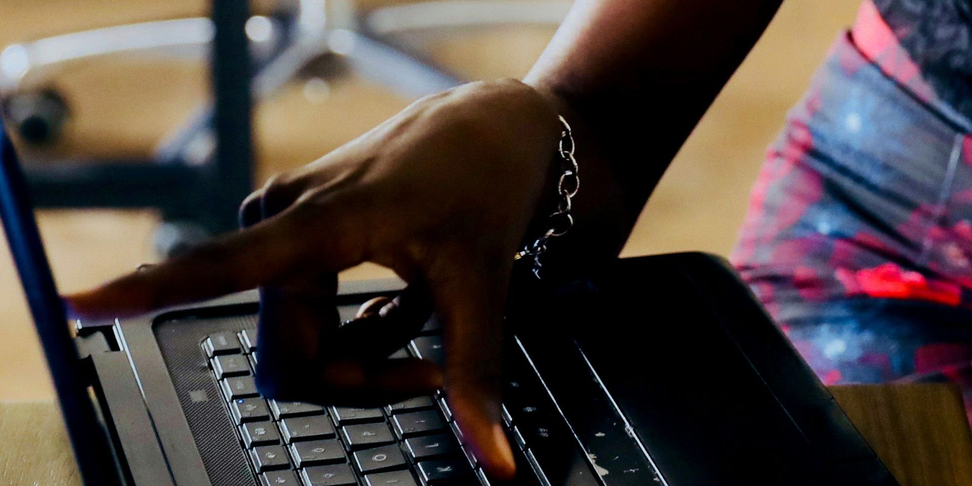 Financial Analyst Working on Laptop for The Day in the Life of a Financial Analyst