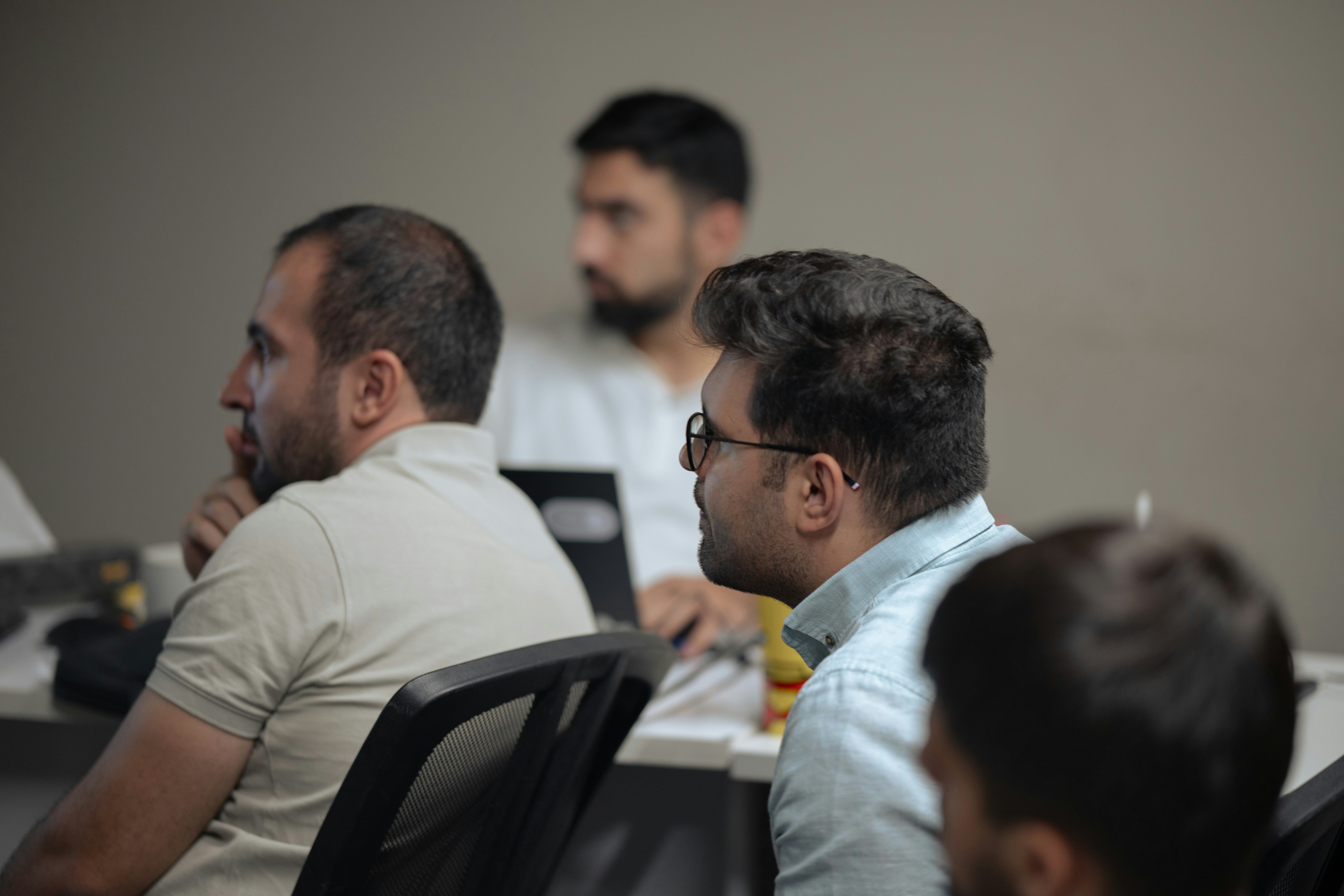Men in Meeting for Improving Employee Engagement with Gamified Learning