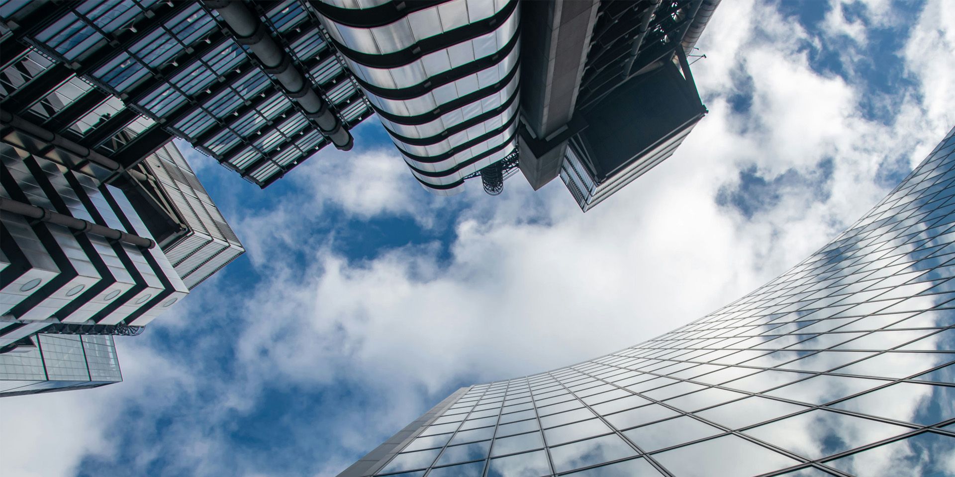 Modern Glass Skyscrapers Against Blue Sky for The Hidden Investment Banking Trends Reshaping Markets in 2025