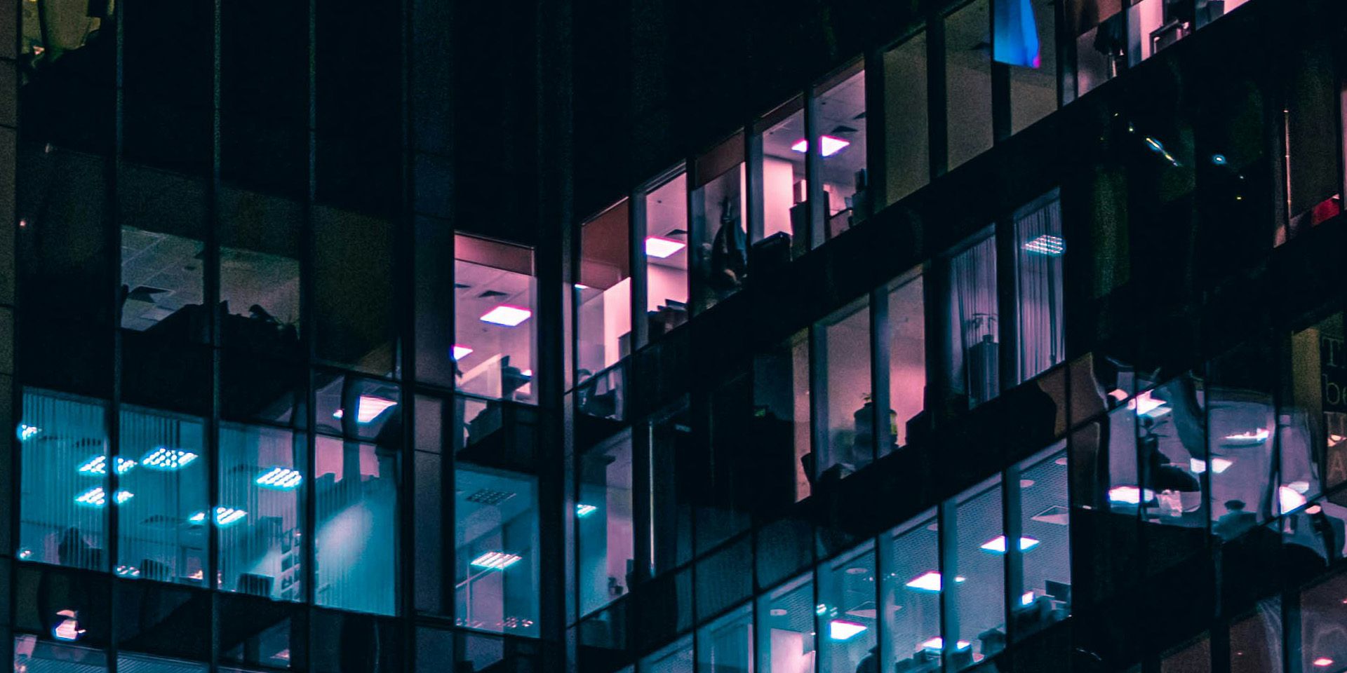 Nighttime View of Illuminated Office Building for How to Use a Debt Restructuring Simulation to Teach Financial Turnaround Strategies