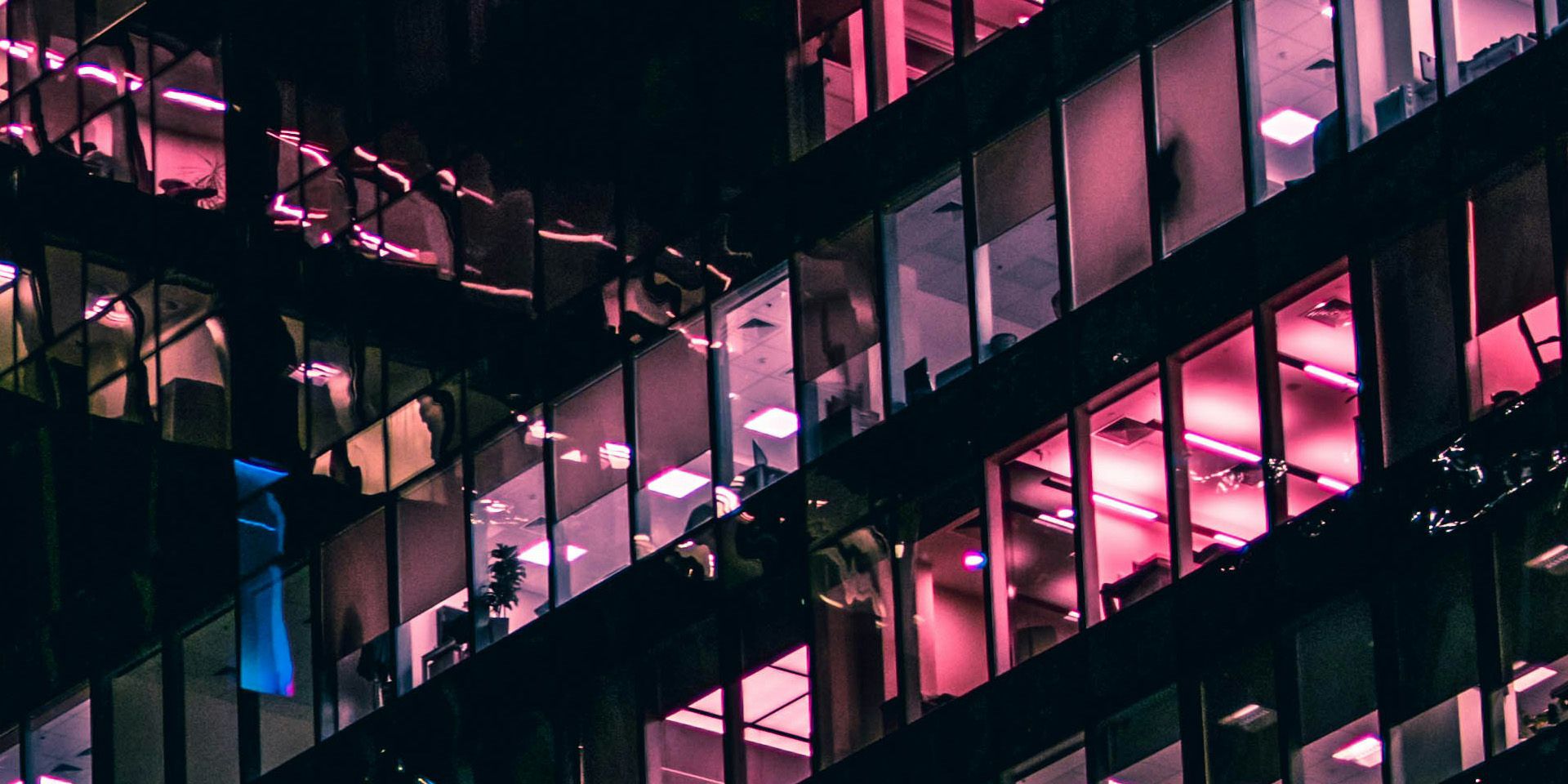 Nighttime View of Illuminated Office Building for How to Use a Debt Restructuring Simulation to Teach Financial Turnaround Strategies