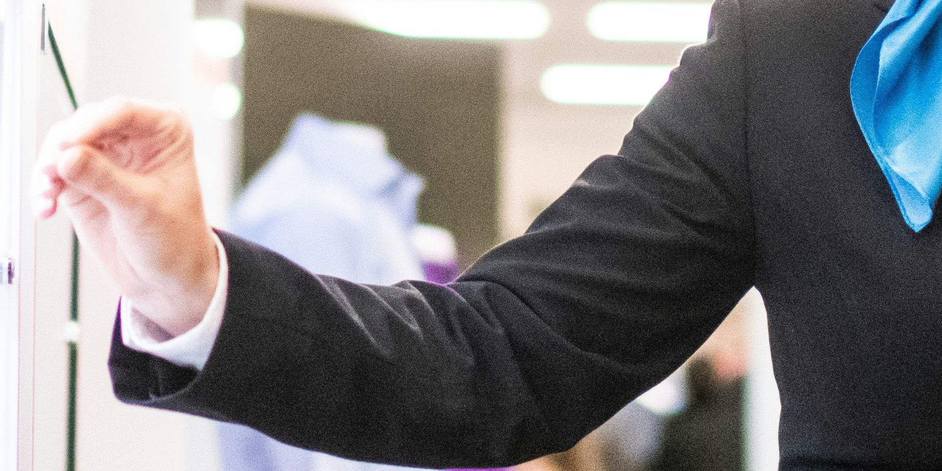 Professional in Business Attire for Corporate Finance Training for Early Careers