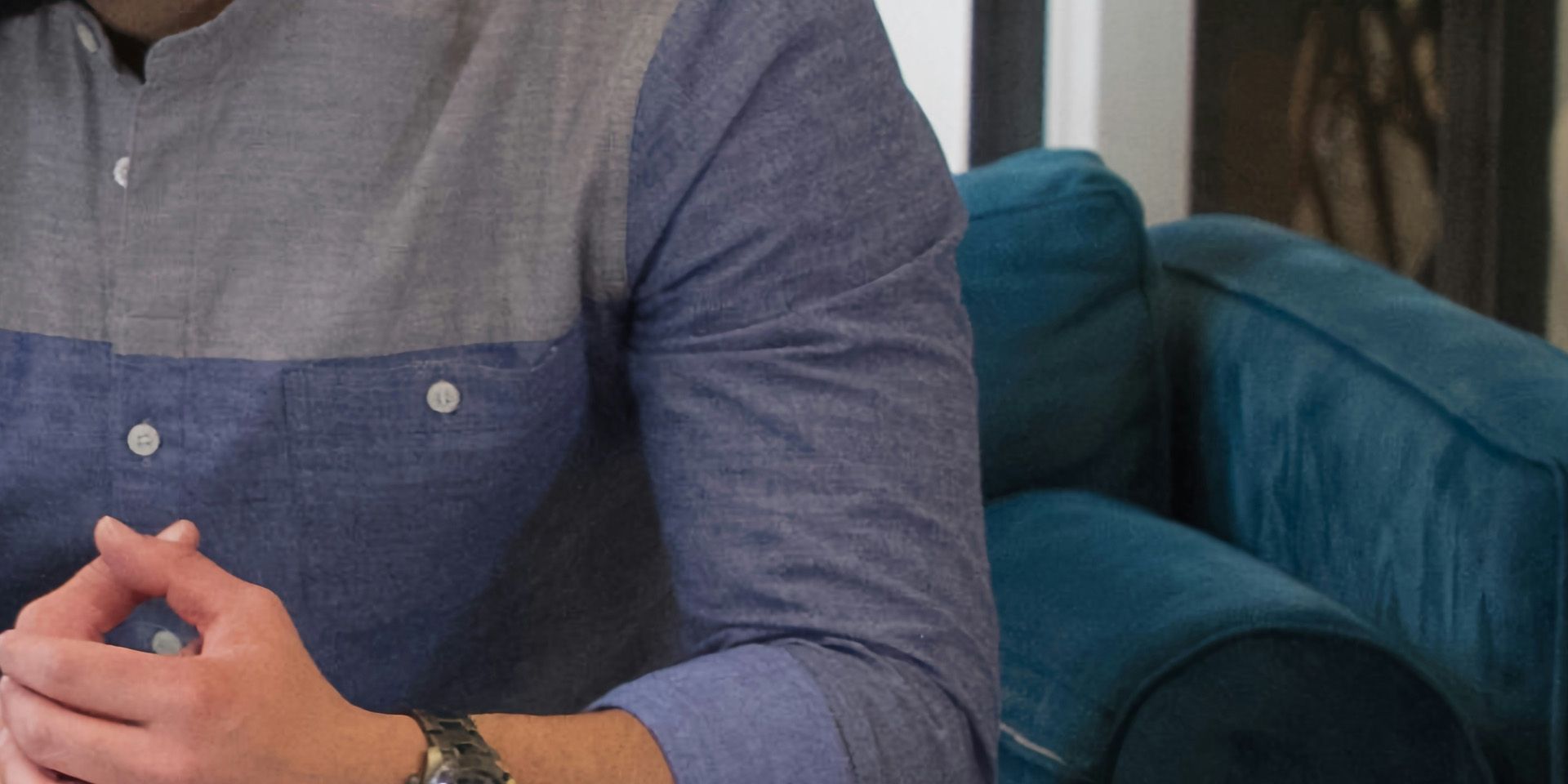 Professional man seated in office for What's the Difference Between Buy Side and Sell Side in Investment Banking?