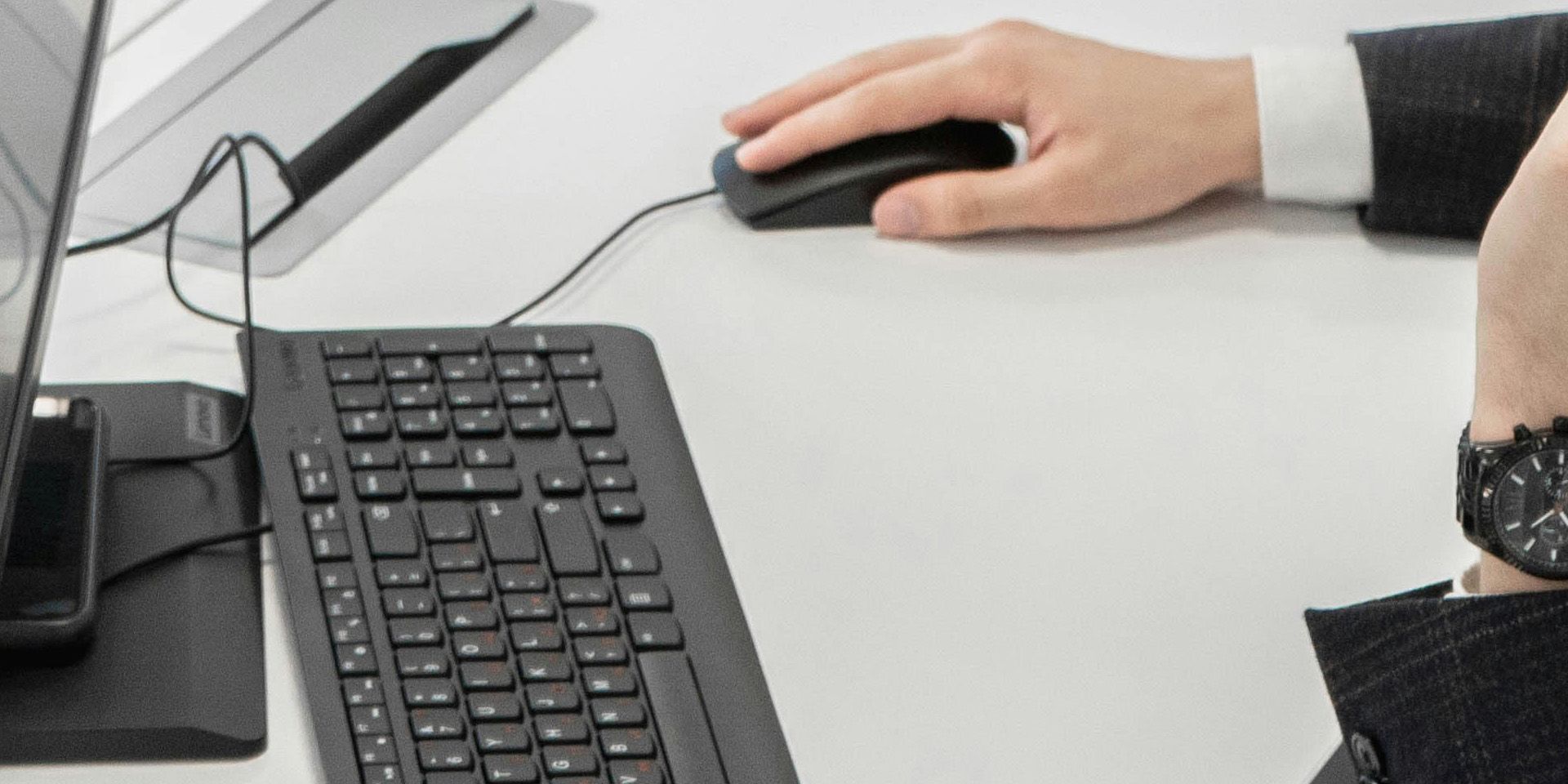 Professional Using Computer Mouse for Wealth Management vs. Private Equity: Which Financial Career Fits You Best?