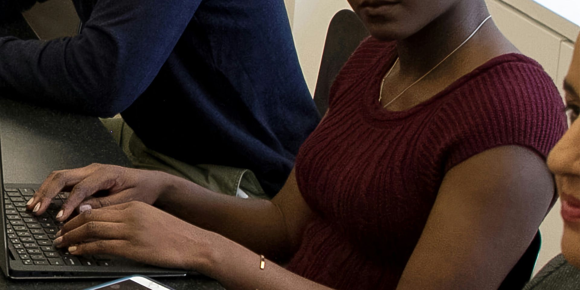 Professional woman working on laptop for Wealth Management as a Career