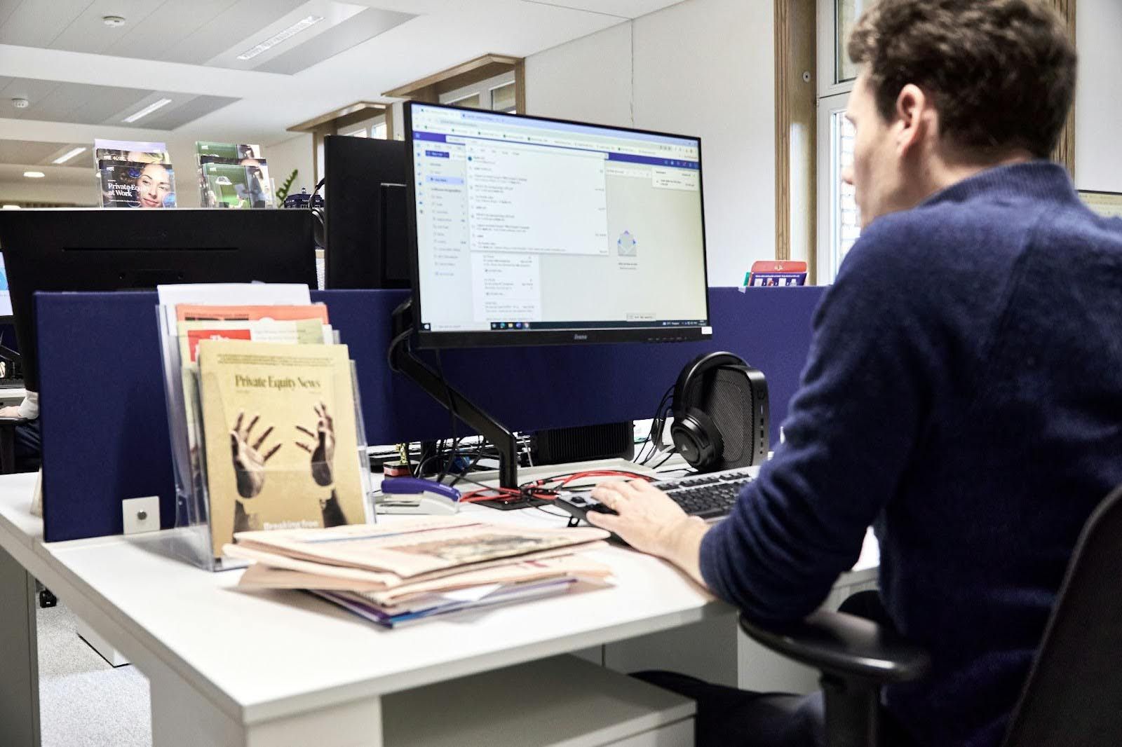 Professional working at desk for Investment Banking Career Path
