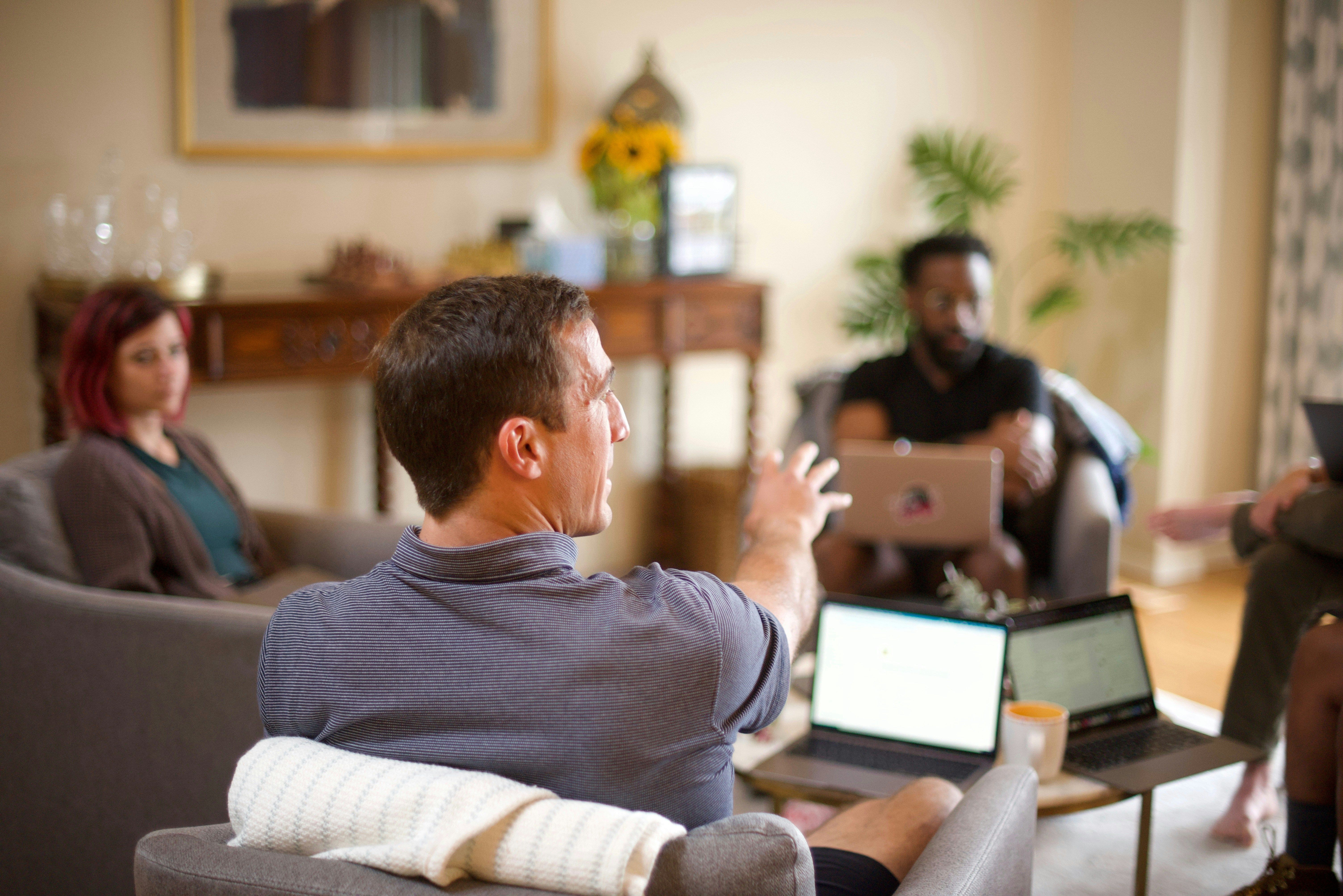 Team Meeting in Living Room for Finance Simulations for MBA Programs