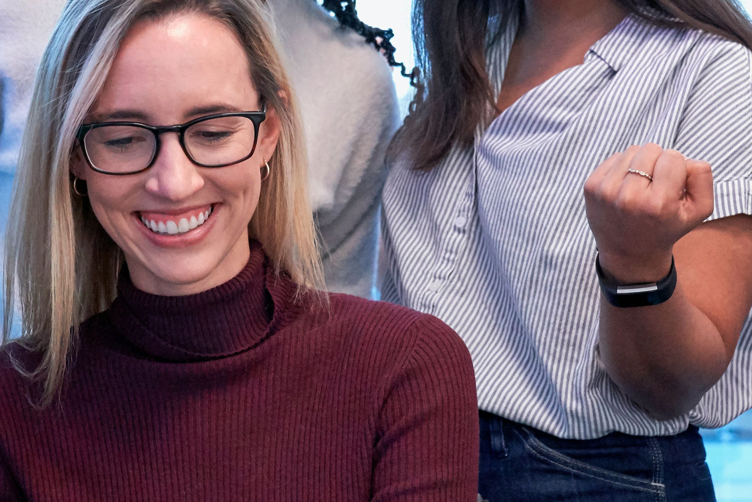 Two women celebrating together for How to Break into Investment Banking: Practical Steps and Simulation Training